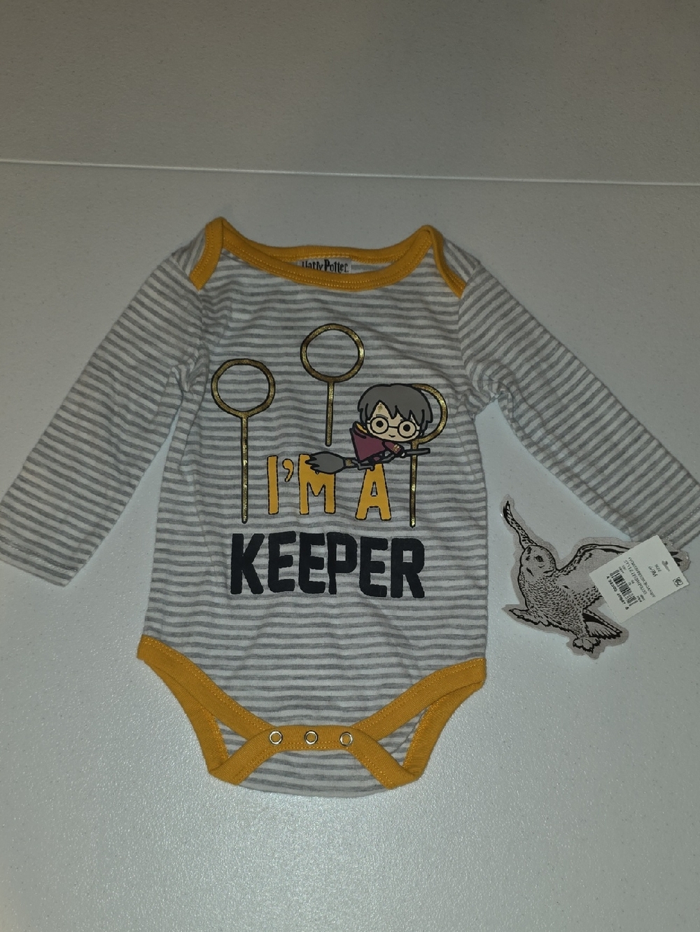 Harry Potter Gray & Yellow Striped 'I'm a Keeper' Baby One-Piece